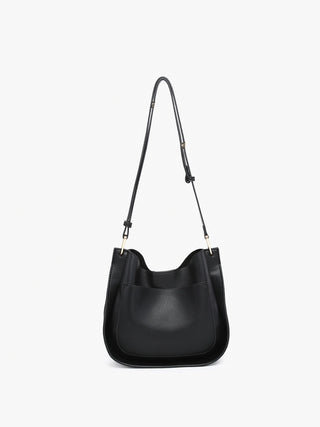 Cute Crossbody featuring large pocket and small removable bag inside.