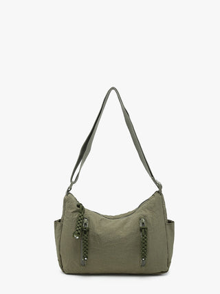 Lovely lightweight nylon purse- plenty of room for your everyday needs.  Adjustable strap & aipper enclosures.