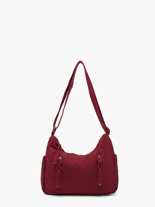 Lovely lightweight nylon purse- plenty of room for your everyday needs.  Adjustable strap & aipper enclosures.
