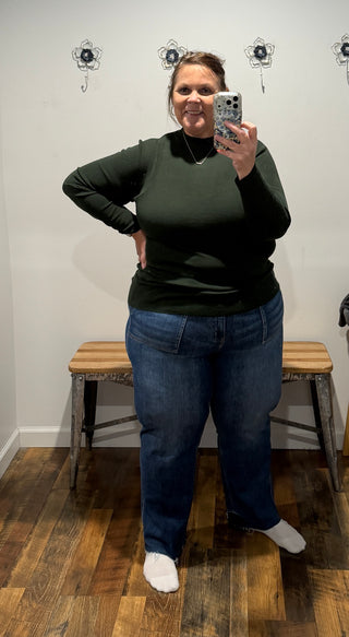 Long sleeves and soft sweater knit keep you warm and comfortable, while the clean, streamlined shape layers beautifully under a jacket or stands on its own.