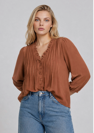 V neckline 3/4 sleeves Elastic cuffs Ruffle trim detail Pintuck detail Relaxed fit Lightweight fabric Solid Not lined Woven top 100%polyester