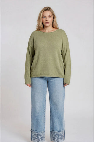 The relaxed, drop-shoulder silhouette gives it that laid-back luxe feel, while the extended shoulders and long sleeves keep things polished and put-together.